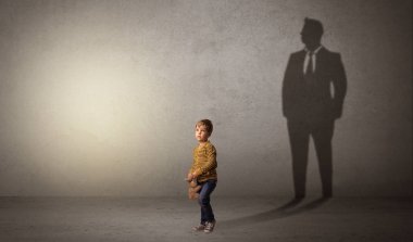 Little boy with businessman shadow clipart