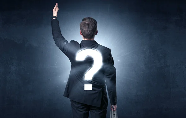 Man standing with question mark on his back — Stock Photo, Image