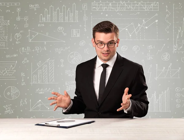 Businessman sitting at a desk — Stock Photo, Image