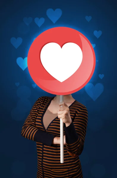 Woman holding heart sign — Stock Photo, Image