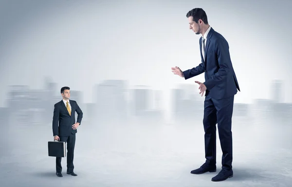 Giant businessman is  afraid of small executor — Stock Photo, Image
