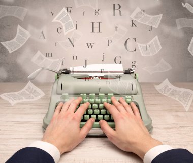 Hand typewriting with flying documents around clipart