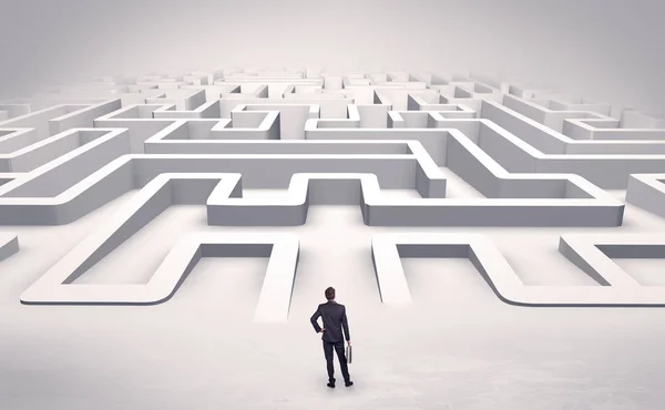 Businessman starting a flat 3d labyrinth — Stock Photo, Image