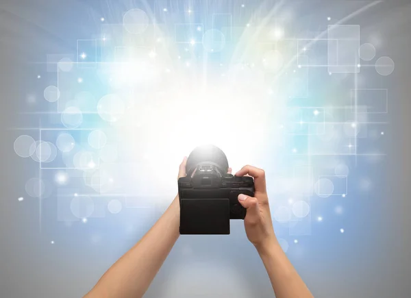 Hand taking photo with glowing flash concept — Stock Photo, Image