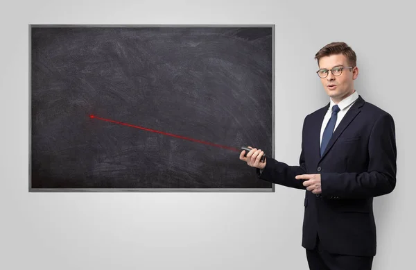 Handsome man teaching in classroom — Stock Photo, Image