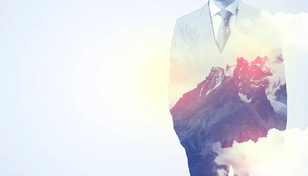 Businessman standing with mountain graphic — Stock Photo, Image