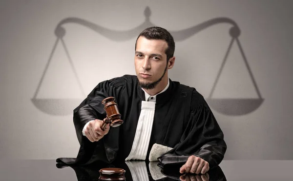 Young judge in gown deciding — Stock Photo, Image