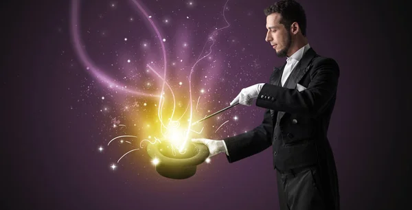 Magician hand conjure miracle from cylinder — Stock Photo, Image