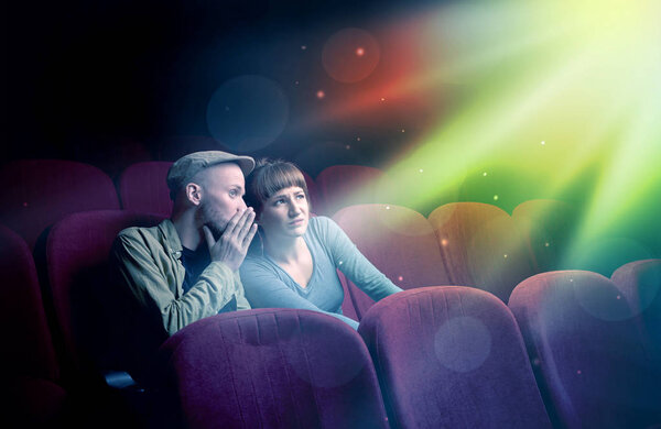 Teenager couple watching movie 