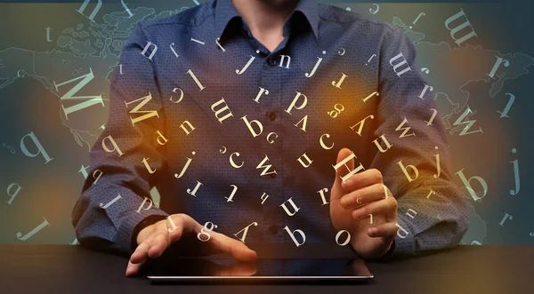 Man typing in formal clothing and letters around — Stock Photo, Image