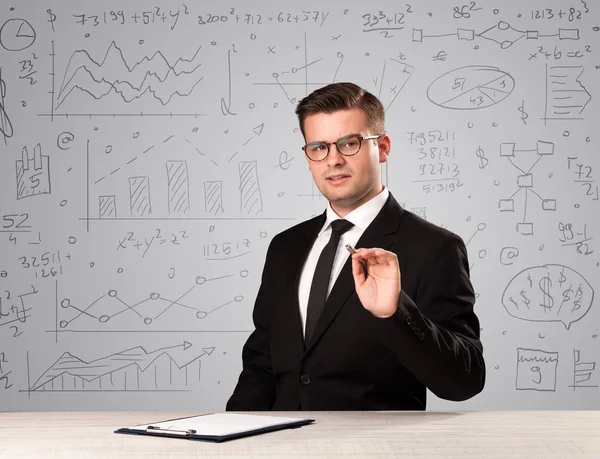 Businessman sitting at a desk — Stock Photo, Image