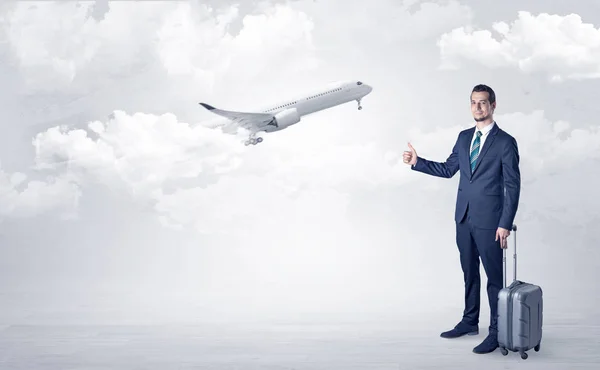 Agent hitchhiking with departing plane concept — Stock Photo, Image