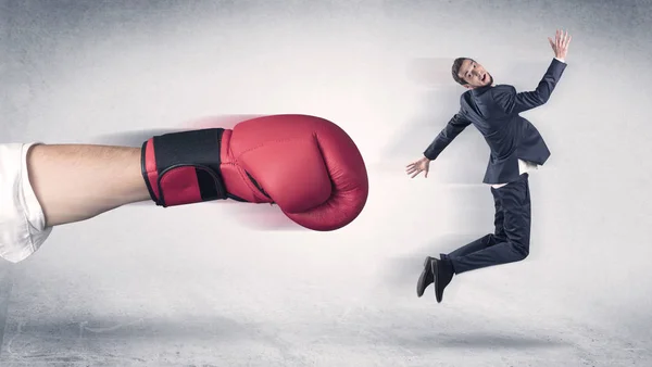 Businessman gets fired by a huge boxing hand