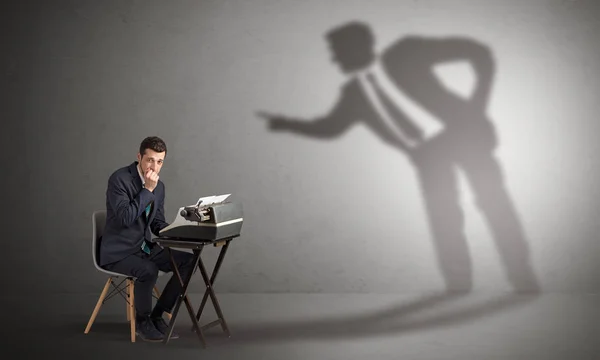 Man working hard and shadow arguing with him — Stock Photo, Image