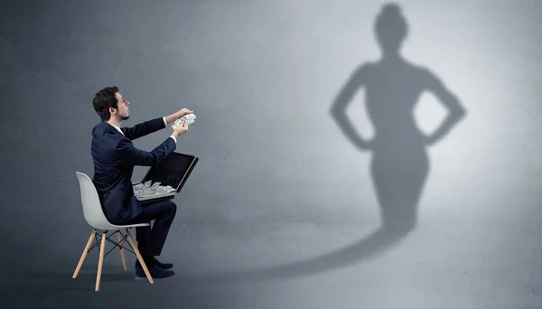 Businessman staying and offering stuffs to a shadow woman — Stock Photo, Image