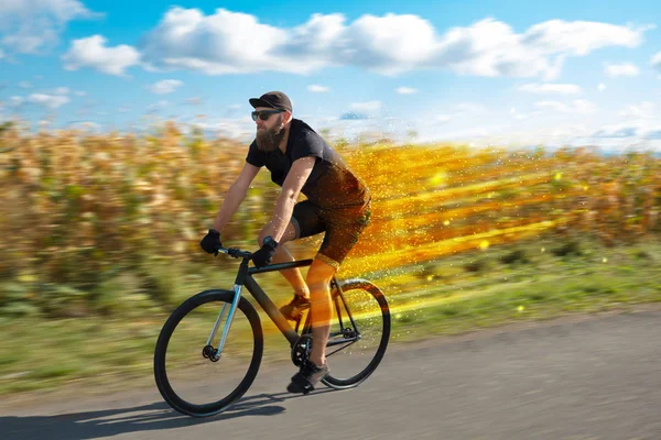 Young riding bicycle in nature — Stock Photo, Image