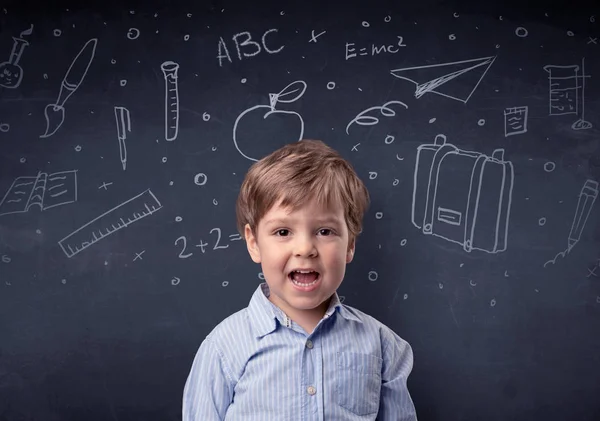 Little boy in front of a drawn up blackboard — Stock Photo, Image