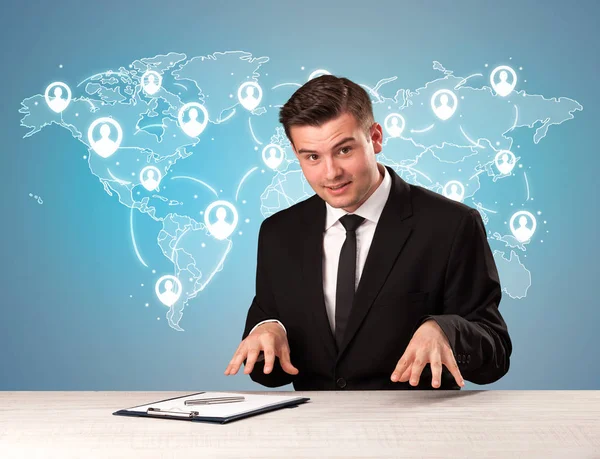 Businessman sitting at a desk — Stock Photo, Image