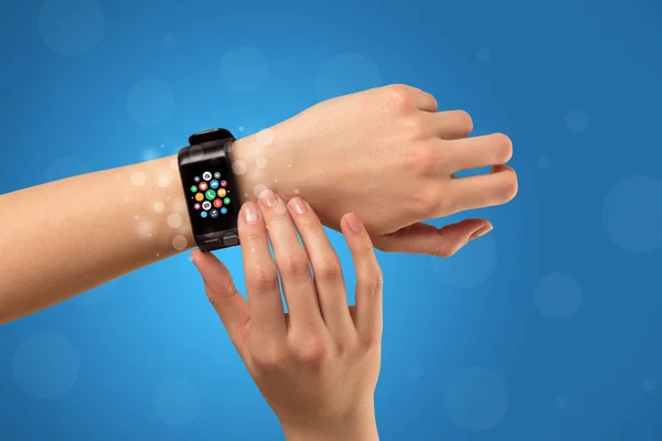 Female hand with smartwatch and app icons — Stock Photo, Image