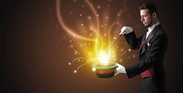 Magician hand conjure miracle from cylinder — Stock Photo, Image