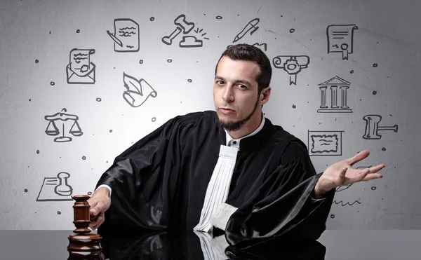 Young judge with court symbols around — Stock Photo, Image