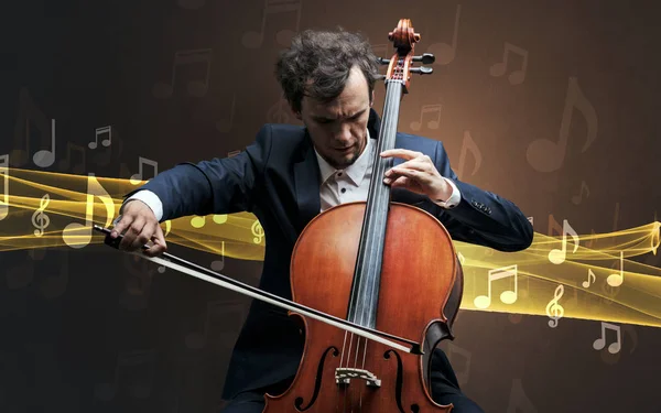 Musiker spielt auf Cello mit Noten herum — Stockfoto