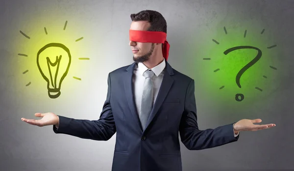 Businessman with idea versus question concept — Stock Photo, Image