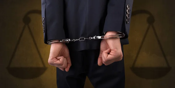 Arrested man with balance on the background — Stock Photo, Image