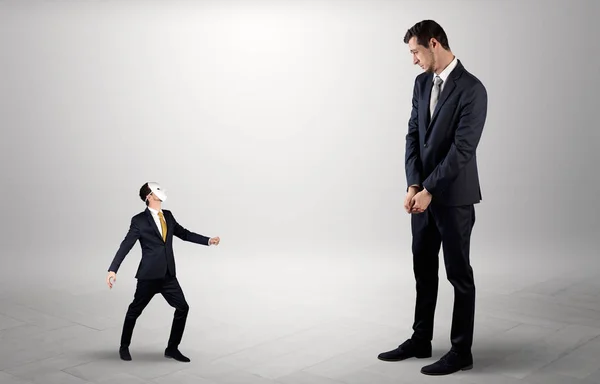 Conflict between small and big businessman — Stock Photo, Image