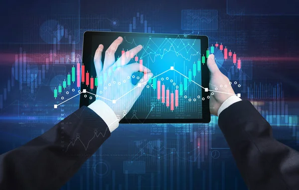 Hand holding tablet with global reports and stock market change concept — Stock Photo, Image