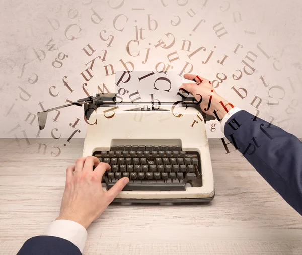 First person perspective elegant hand typing with flying letters concept — Stock Photo, Image