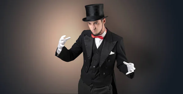 Magician holds something invisible Royalty Free Stock Photos