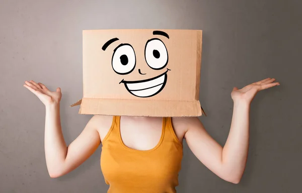 Young girl with happy cardboard box face — Stock Photo, Image