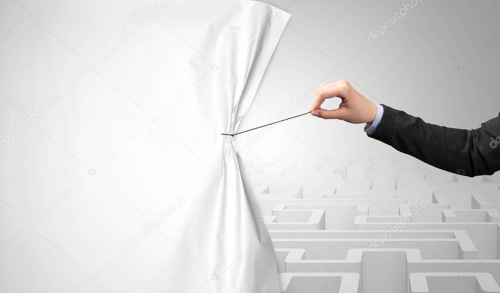 Hand pulling paper curtain