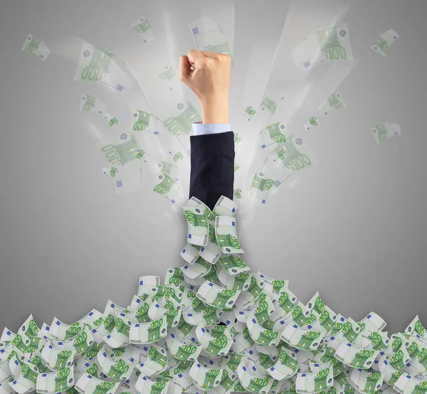 Hand buried in cash pile and trying to get out — Stock Photo, Image