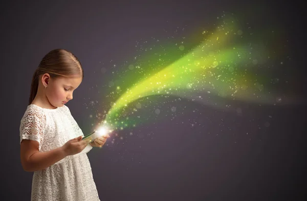 Little kid playing on sparkling tablet — Stock Photo, Image