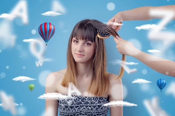 Young woman at hairdresser with air balloon theme — Stock Photo, Image