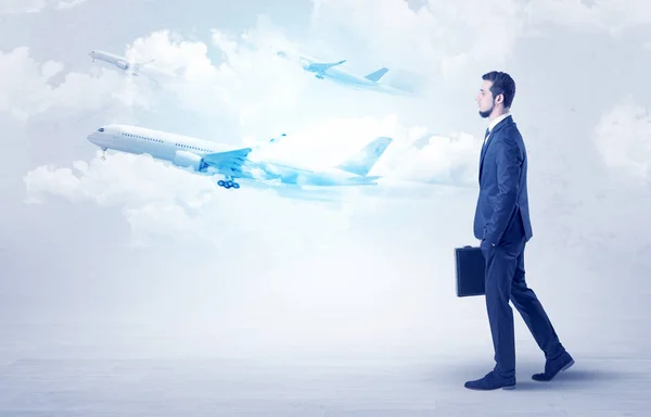 Businessman going somewhere with airplane — Stock Photo, Image