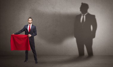 Boğa güreşçisi kavramı ve onun gölgesi arka planda ile işadamı