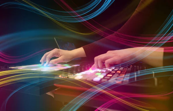 Hand mixing music on dj controller with colorful vibe concept — Stock Photo, Image