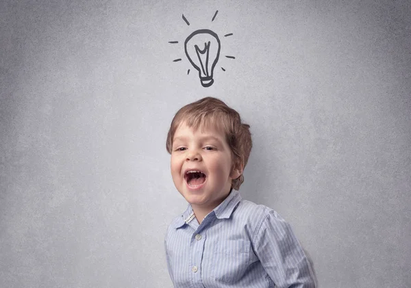 Smart kid in front of a drawn up grey wall — Stock Photo, Image