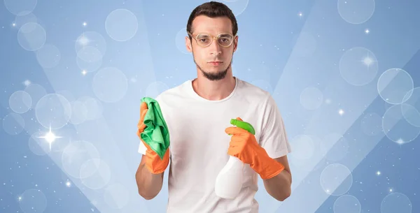 Glittered background with male housekeeper — Stock Photo, Image