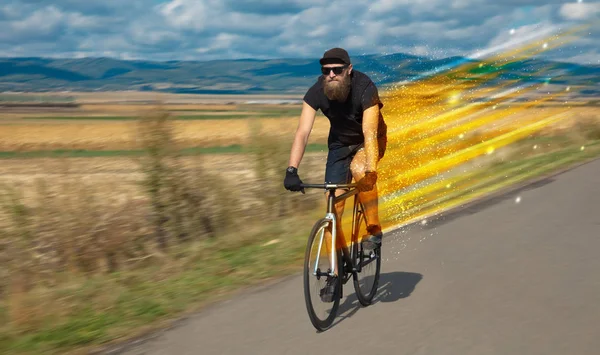 Young riding bicycle in nature — Stock Photo, Image