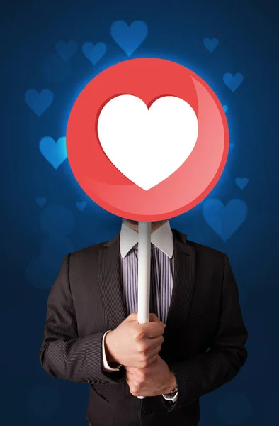 Businessman holding heart sign — Stock Photo, Image