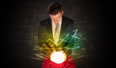 İşadamı borsa sihirli bir top ile geleceği tahmin