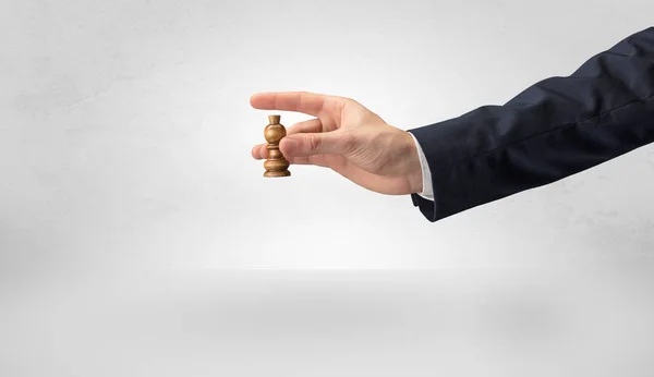 Big hand taking his next step on chess game — Stock Photo, Image