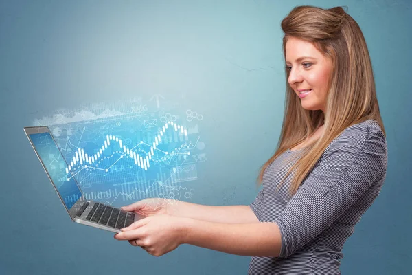 Woman holding laptop with financial concept — Stock Photo, Image