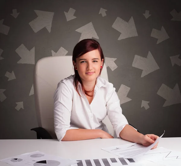 Manager in front of the office desk with direction concept — Stock Photo, Image