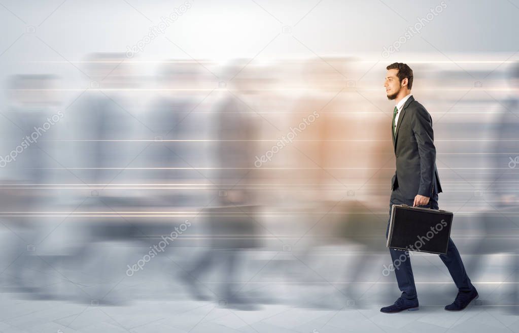 Businessman walking on a crowded street