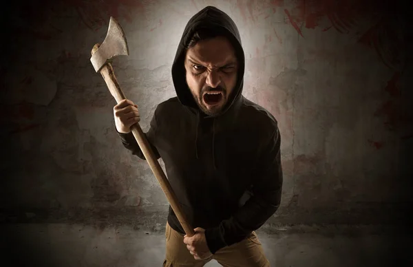 Armed assassin in an empty bloody room concept — Stock Photo, Image